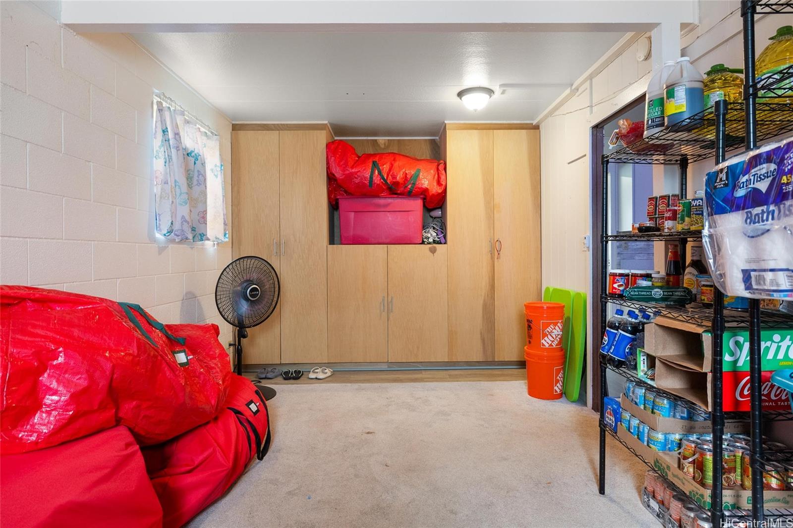 85-576 Waianae Valley Road, Unit A Waianae, HI 96792 - Photo 15 of 20 another view of the downstairs room in the 2-story home