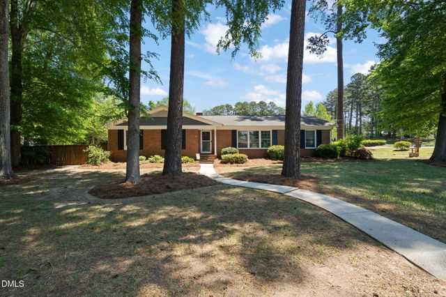 a view of a house with a yard patio and a patio