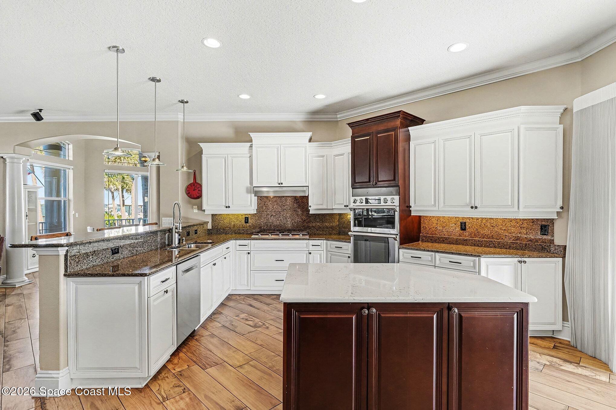 1 Point View Place Cocoa, FL 32926 - Photo 11 of 45 a kitchen with stainless steel appliances granite countertop a sink stove and refrigerator