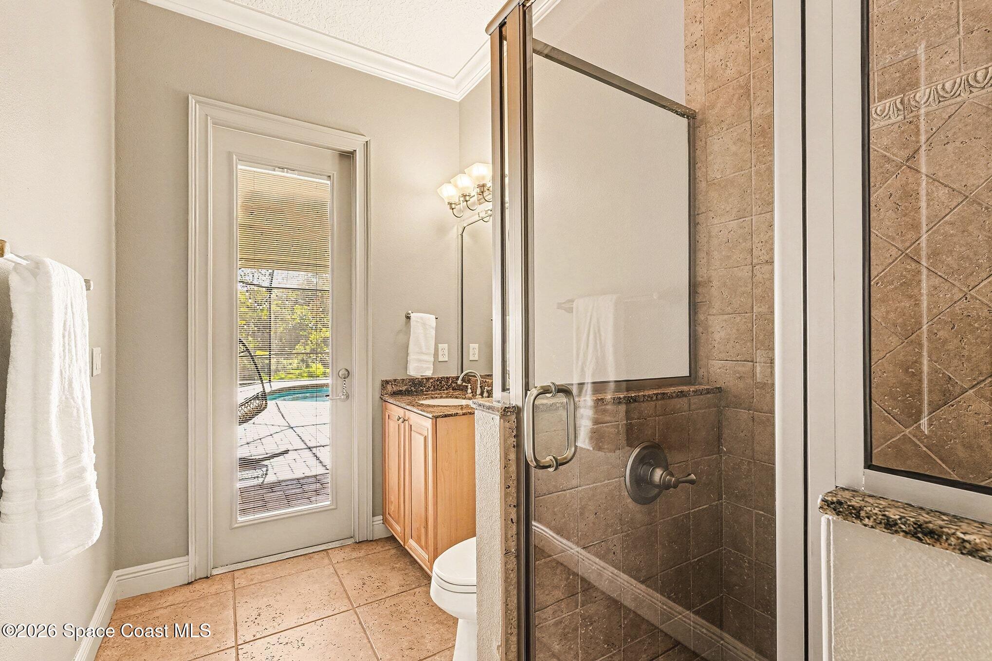 1 Point View Place Cocoa, FL 32926 - Photo 14 of 45 a bathroom with a glass shower door