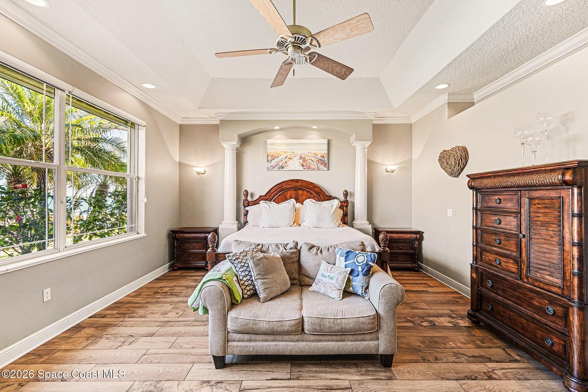 1 Point View Place Cocoa, FL 32926 - Photo 17 of 45 a bedroom with a bed couch and a window