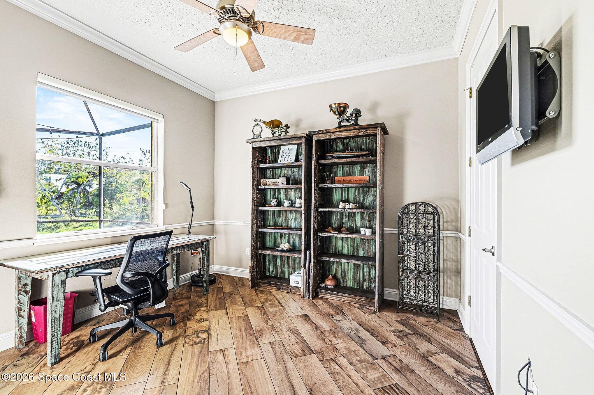 1 Point View Place Cocoa, FL 32926 - Photo 28 of 45 a view of a livingroom with furniture hardwood floor and workspace