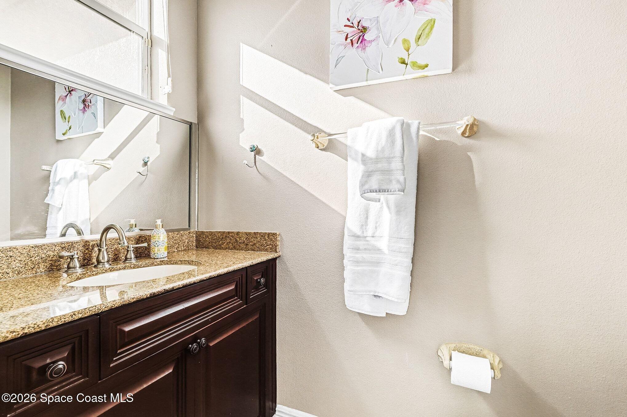 1 Point View Place Cocoa, FL 32926 - Photo 29 of 45 a bathroom with a granite countertop sink and a mirror