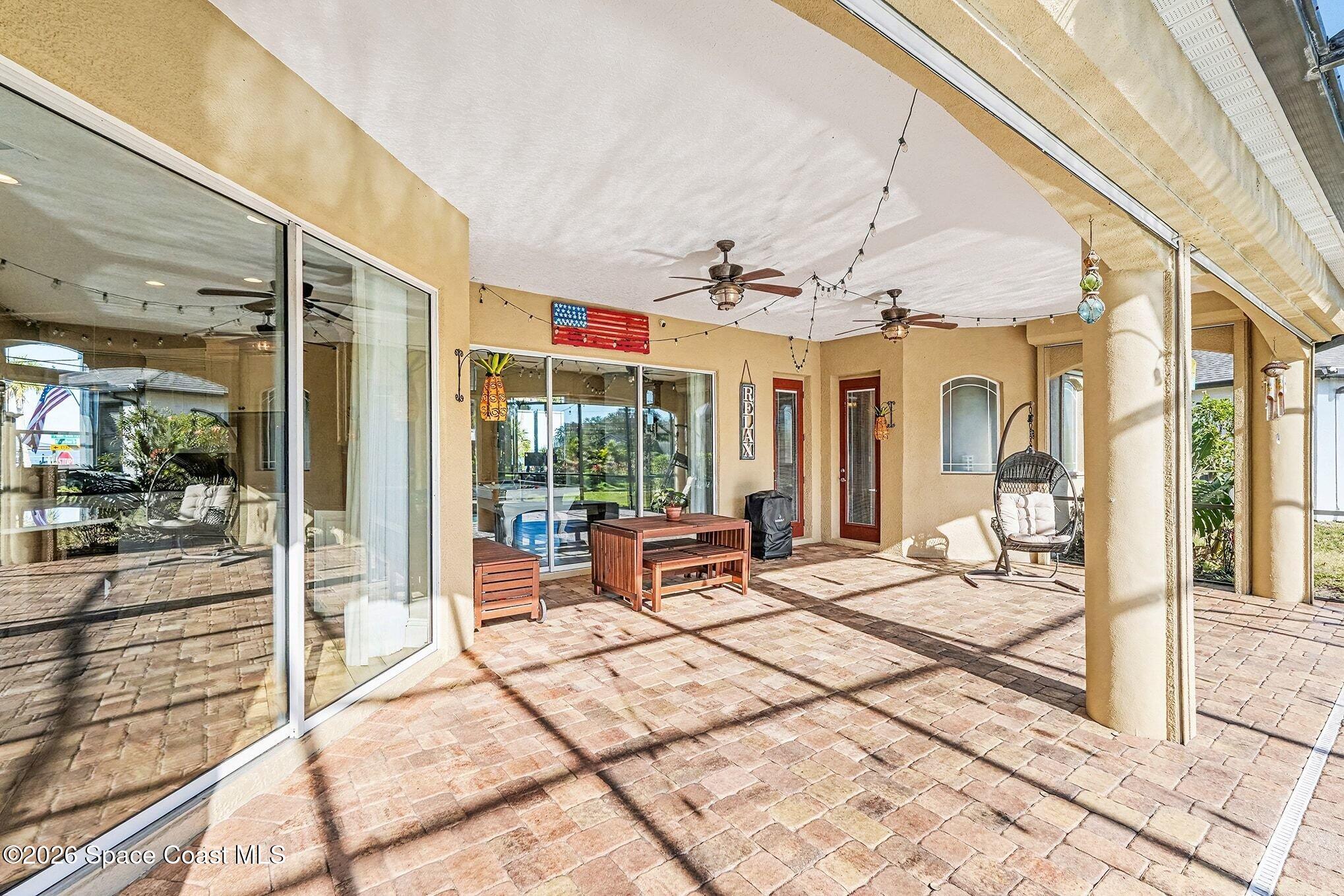 1 Point View Place Cocoa, FL 32926 - Photo 30 of 45 a building outdoor space with patio furniture and potted plants