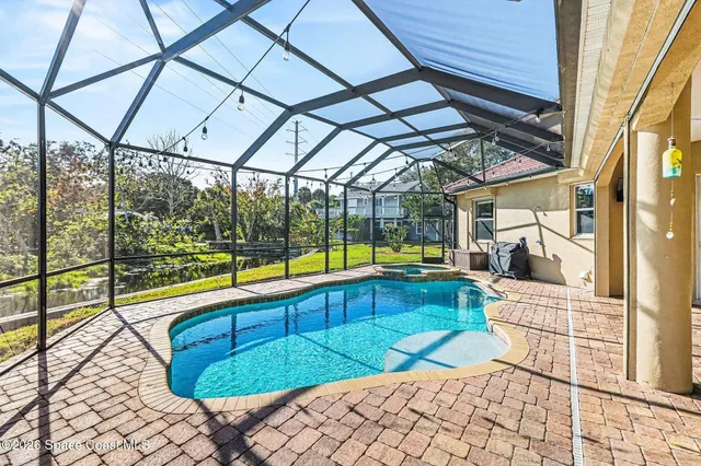 a view of swimming pool with seating area