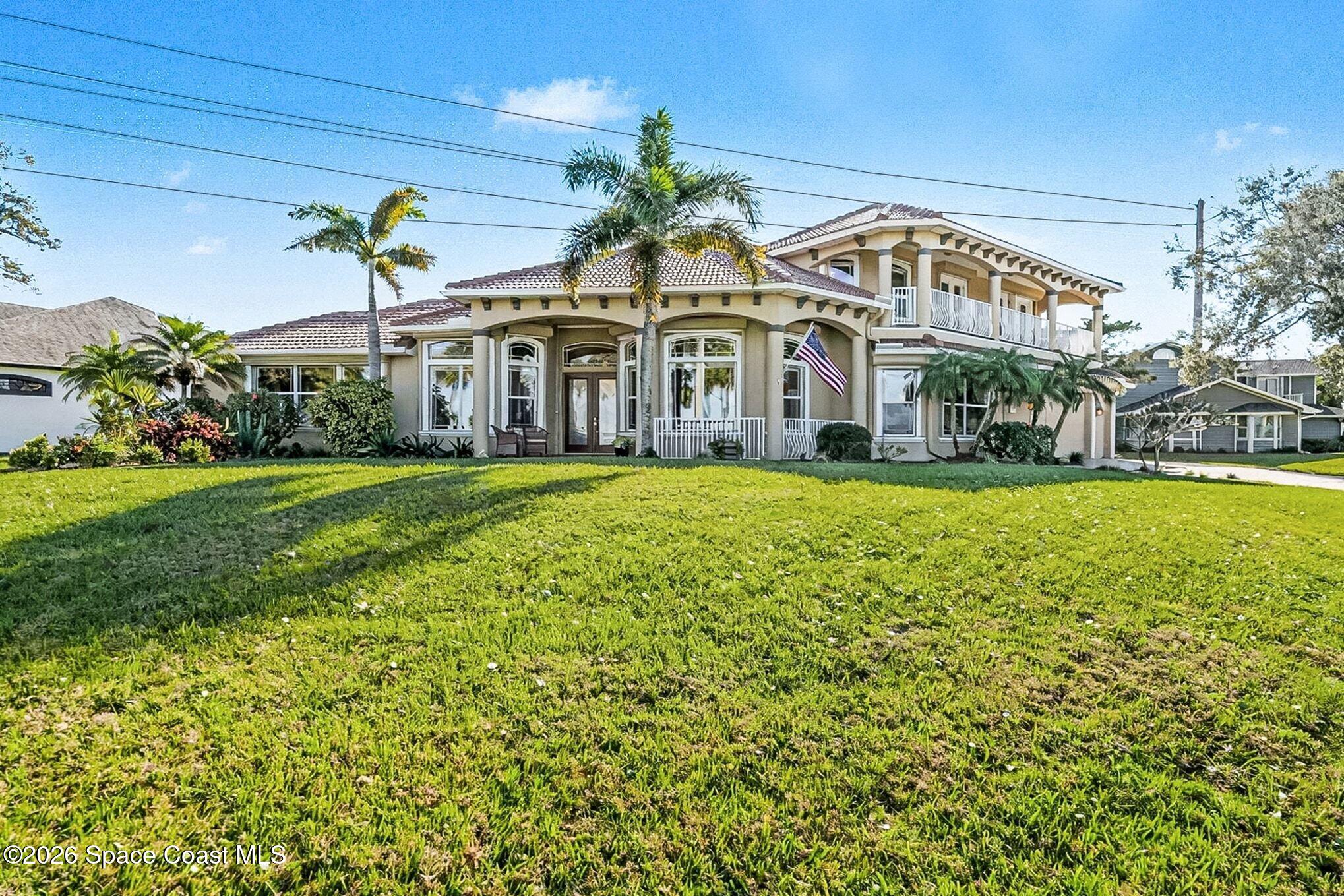 1 Point View Place Cocoa, FL 32926 - Photo 40 of 45 a view of a house with a big yard and potted plants