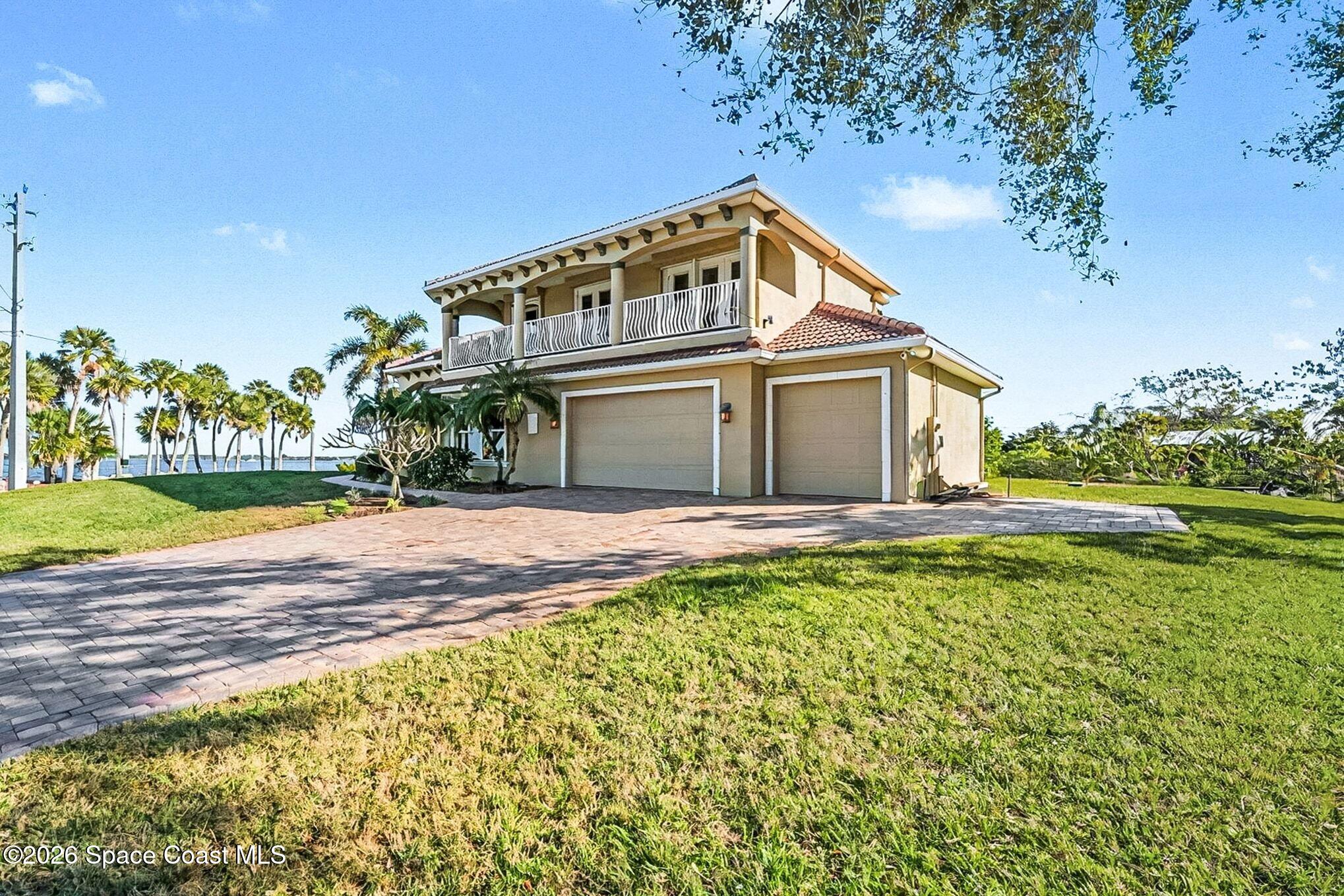 1 Point View Place Cocoa, FL 32926 - Photo 43 of 45 a view of a house with a yard