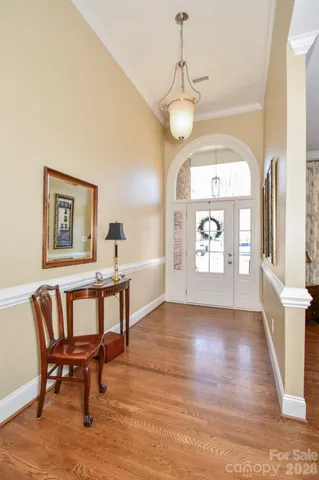 a view of a livingroom with furniture window and wooden floor