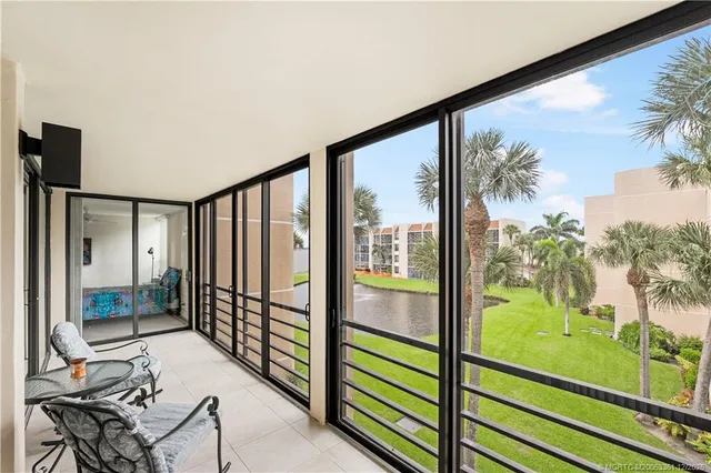 a view of a floor to ceiling window and an outdoor view