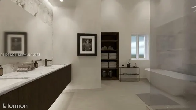 a en suite bathroom with a double vanity sink and a bathtub