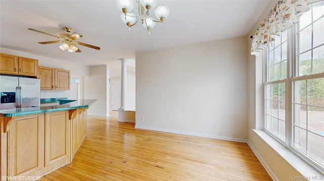 a view of a kitchen from the windows