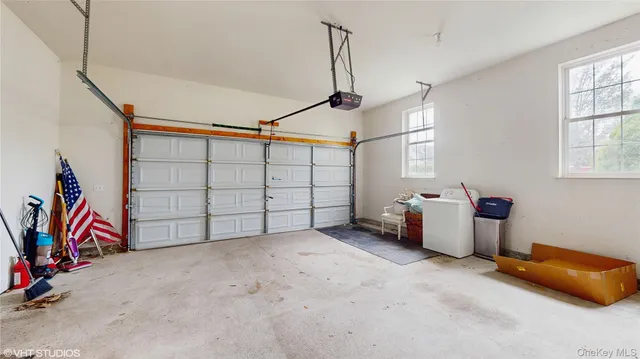 a view of a garage with stairs