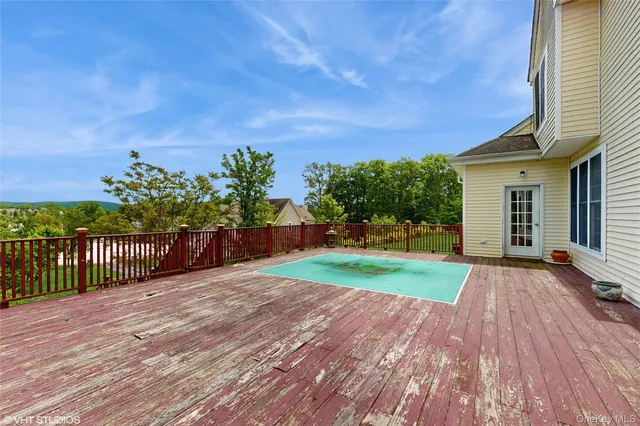 a picture of a bench in front of a wall