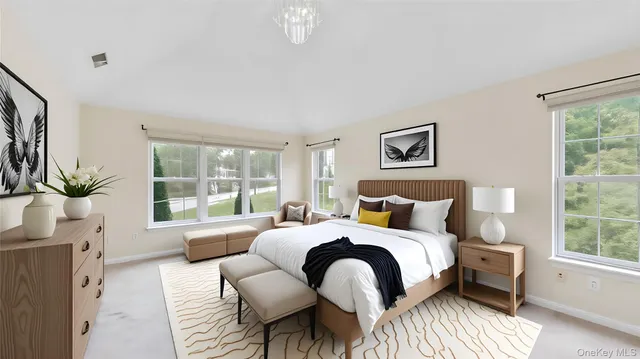 a bedroom with a bed large window and couch