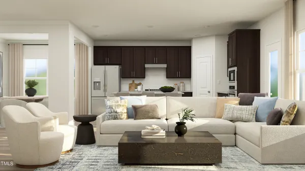 a living room with couches and a flat screen tv