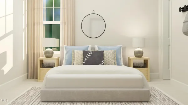 a bedroom with a bed mirror and window