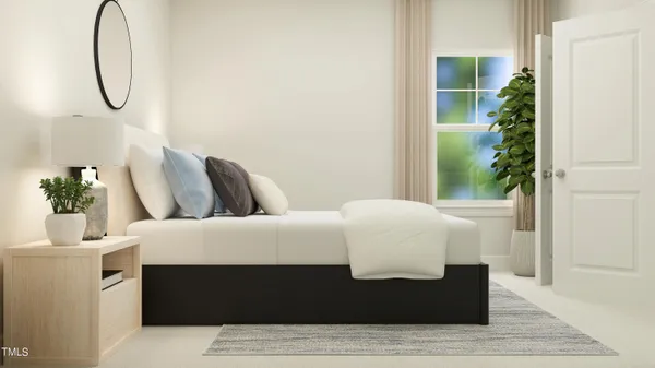 a bedroom with a bed table and a potted plant