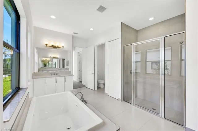 a bathroom with a sink a vanity and mirror