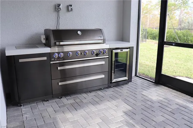 a view of a room with a table and chairs