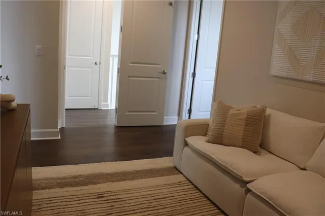 a bedroom with a bed and a lamp