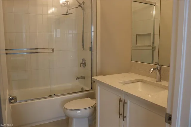 a bedroom with two beds and a large window