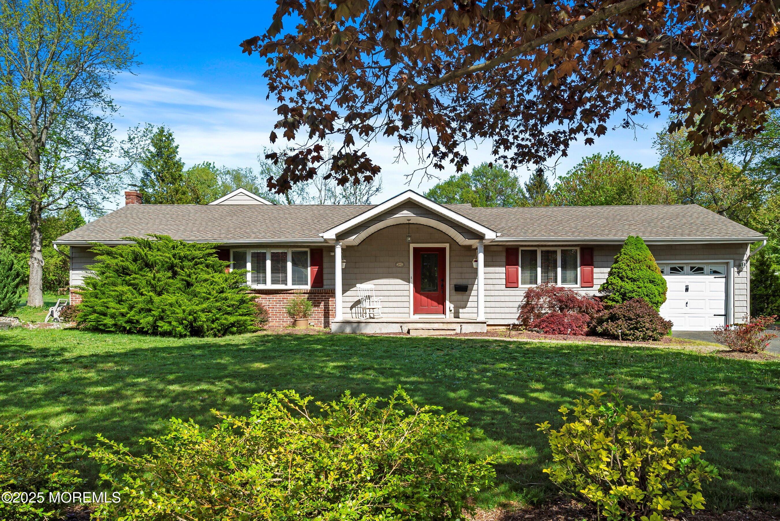 601 E Road Middletown, NJ 07748 - Photo 1 of 36 a front view of a house with a yard and porch