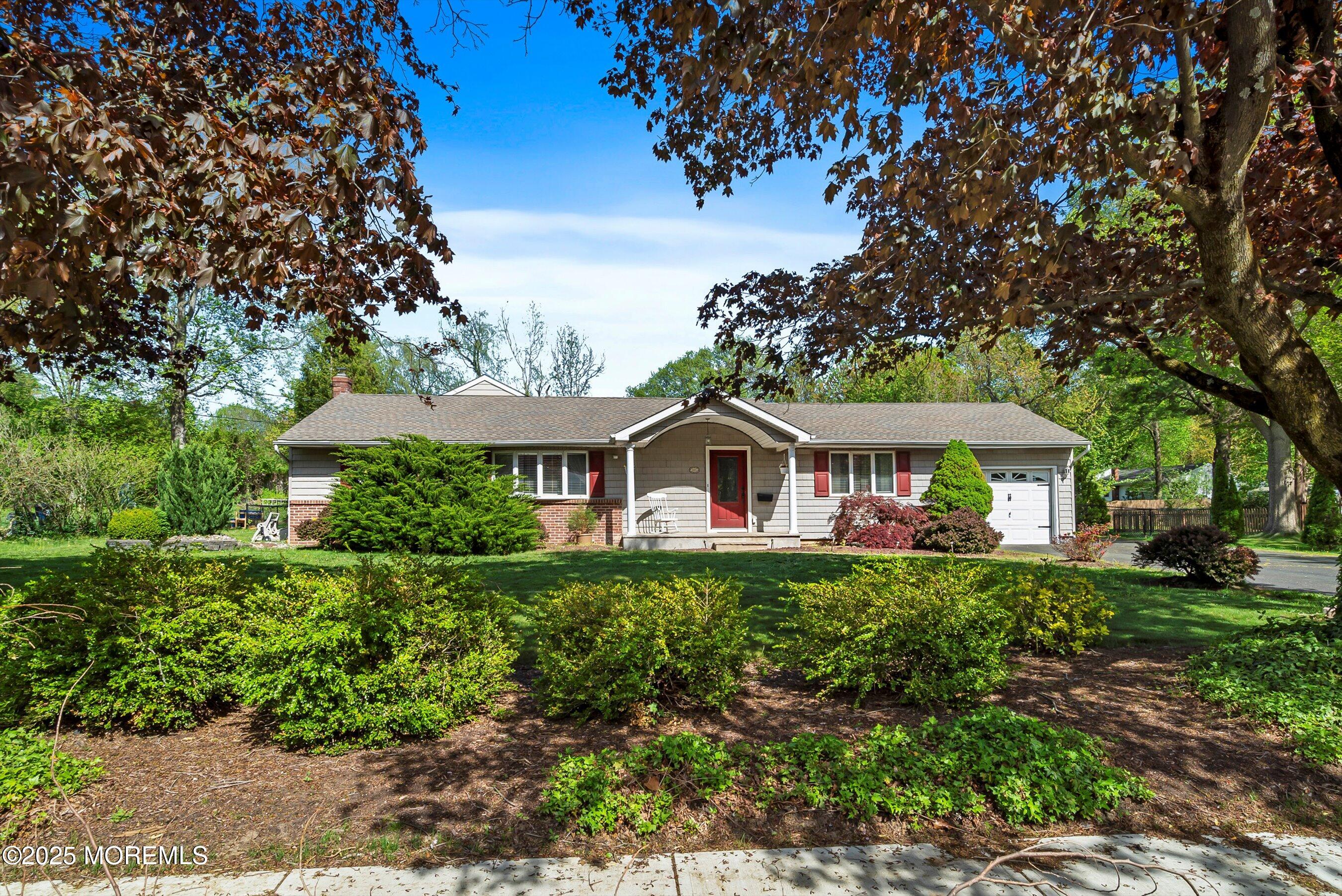 601 E Road Middletown, NJ 07748 - Photo 3 of 36 a front view of a house with a garden