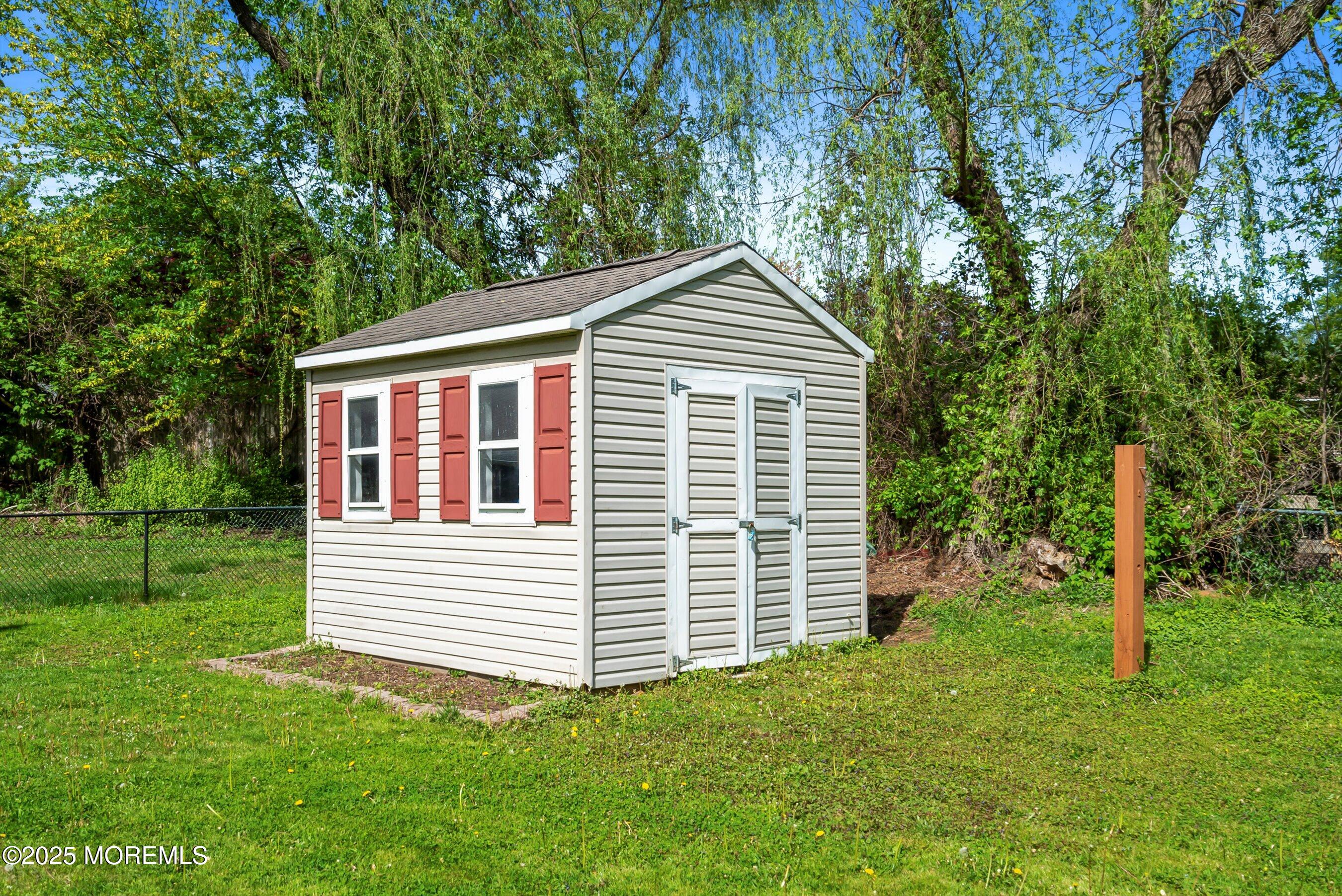 601 E Road Middletown, NJ 07748 - Photo 33 of 36 a front view of a house with a yard