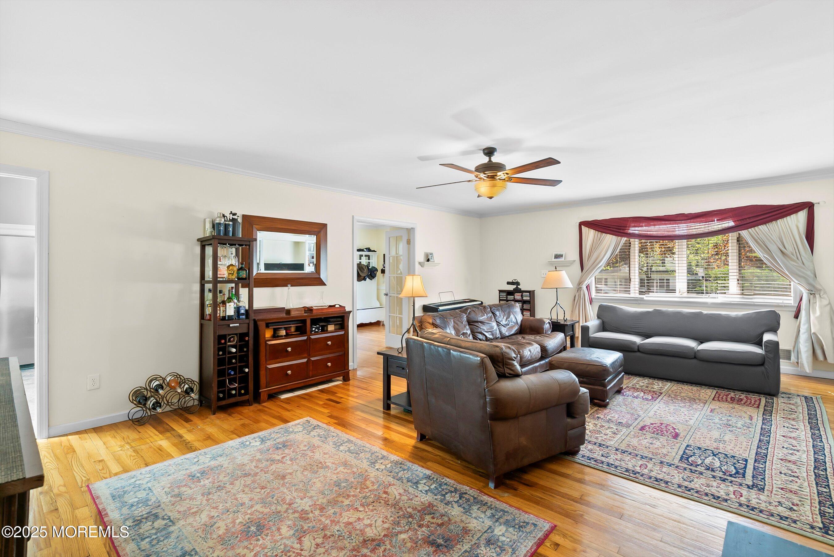 601 E Road Middletown, NJ 07748 - Photo 8 of 36 a living room with furniture and a flat screen tv