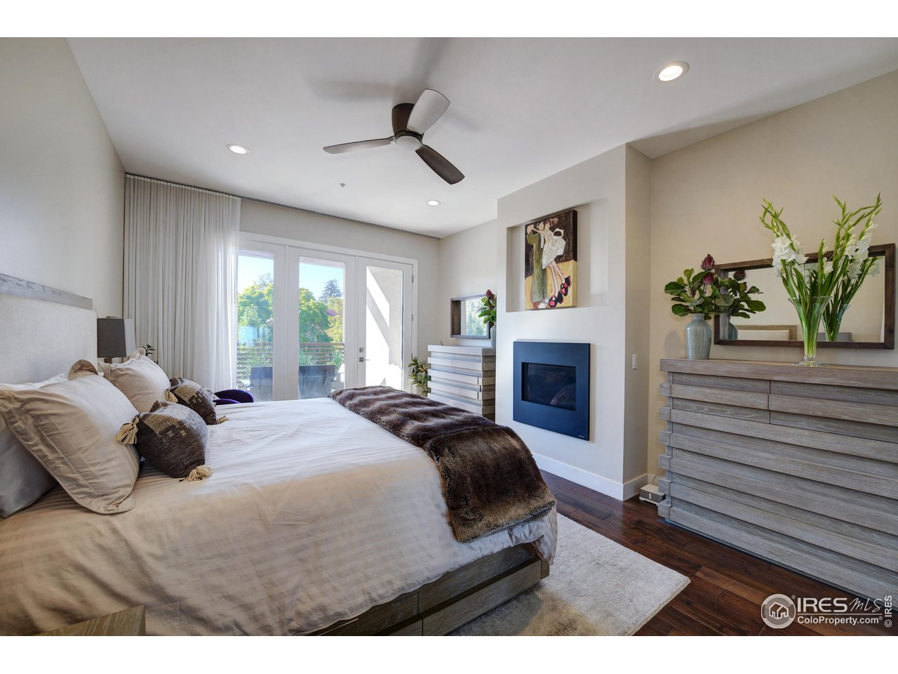 1217 High Street Boulder, CO 80304 - Photo 12 of 31 a bedroom with a bed painting on wall and a large window
