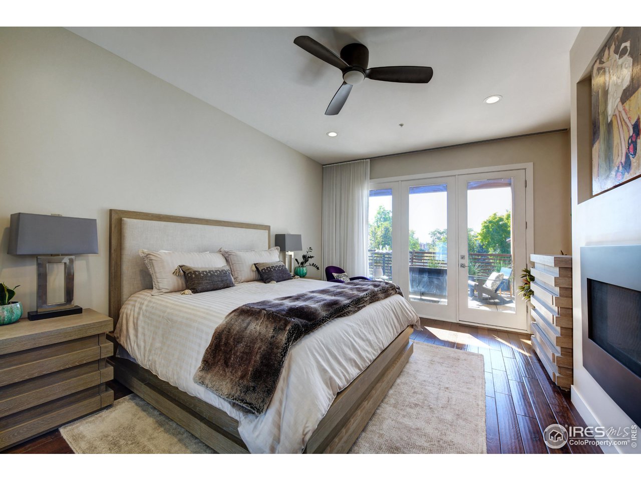 1217 High Street Boulder, CO 80304 - Photo 14 of 31 a bedroom with a bed a fireplace and a large window