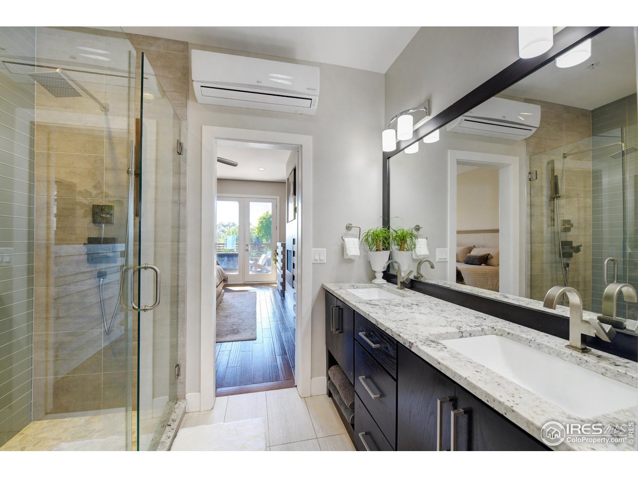 1217 High Street Boulder, CO 80304 - Photo 15 of 31 a bathroom with a granite countertop sink a mirror and a shower