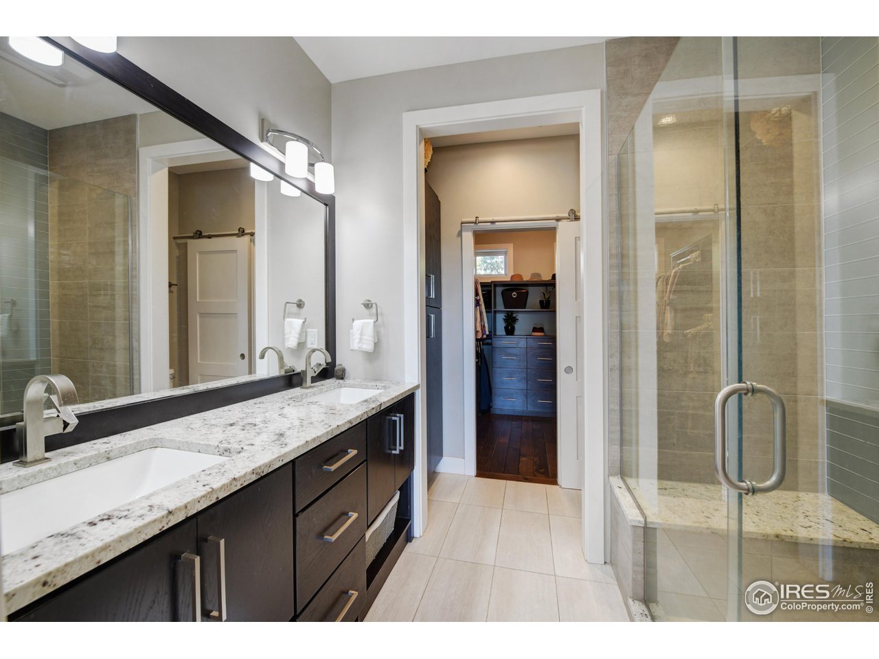 1217 High Street Boulder, CO 80304 - Photo 16 of 31 a bathroom with a granite countertop sink mirror and double