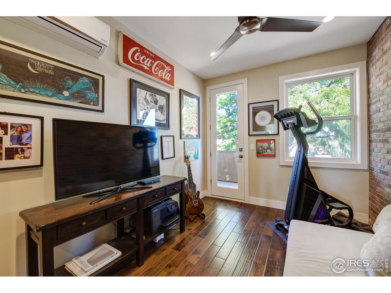 1217 High Street Boulder, CO 80304 - Photo 18 of 31 a living room with furniture and a flat screen tv
