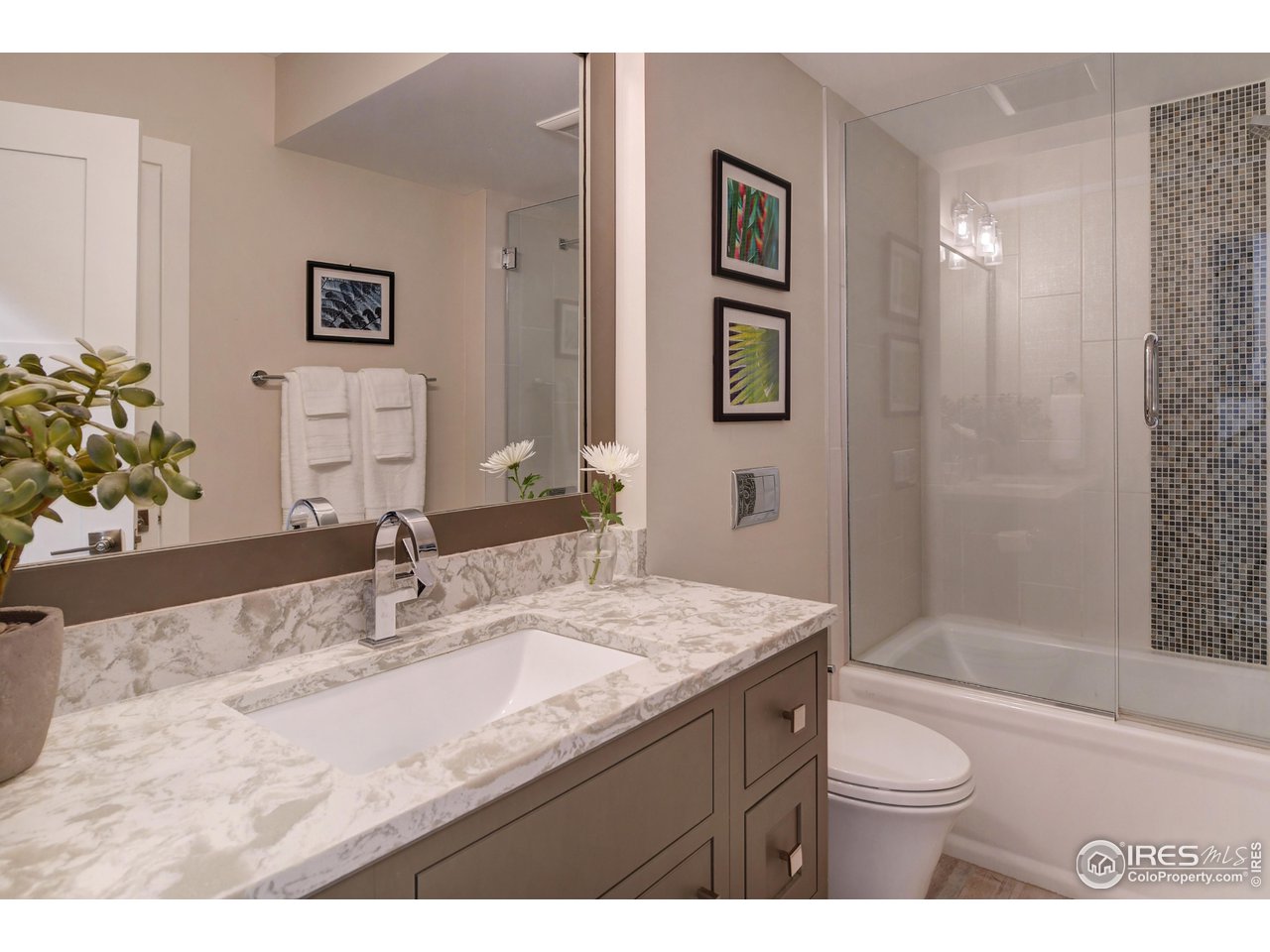 1217 High Street Boulder, CO 80304 - Photo 20 of 31 a bathroom with a granite countertop sink a toilet a mirror and shower