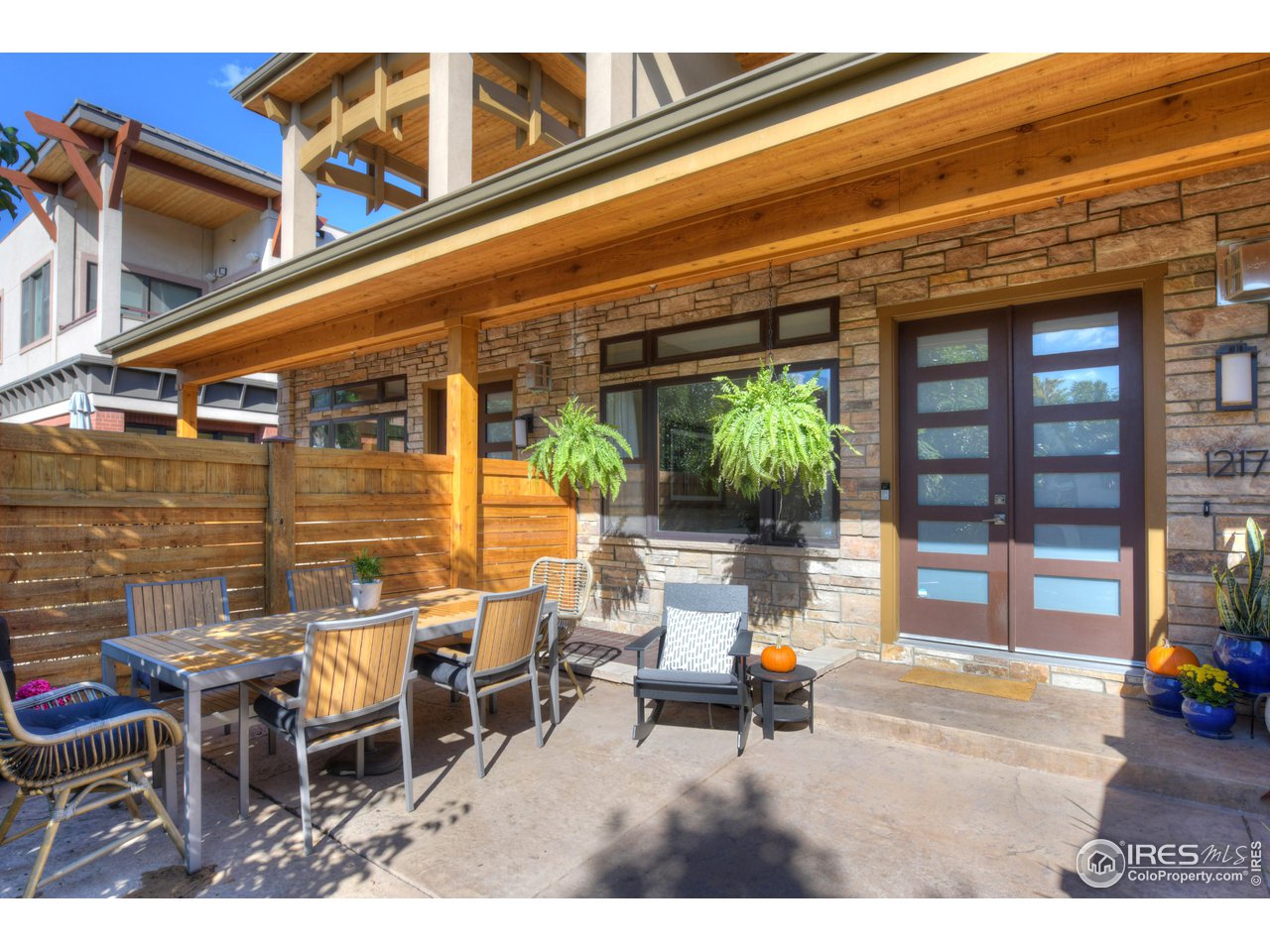 1217 High Street Boulder, CO 80304 - Photo 2 of 31 a backyard of a house with outdoor seating