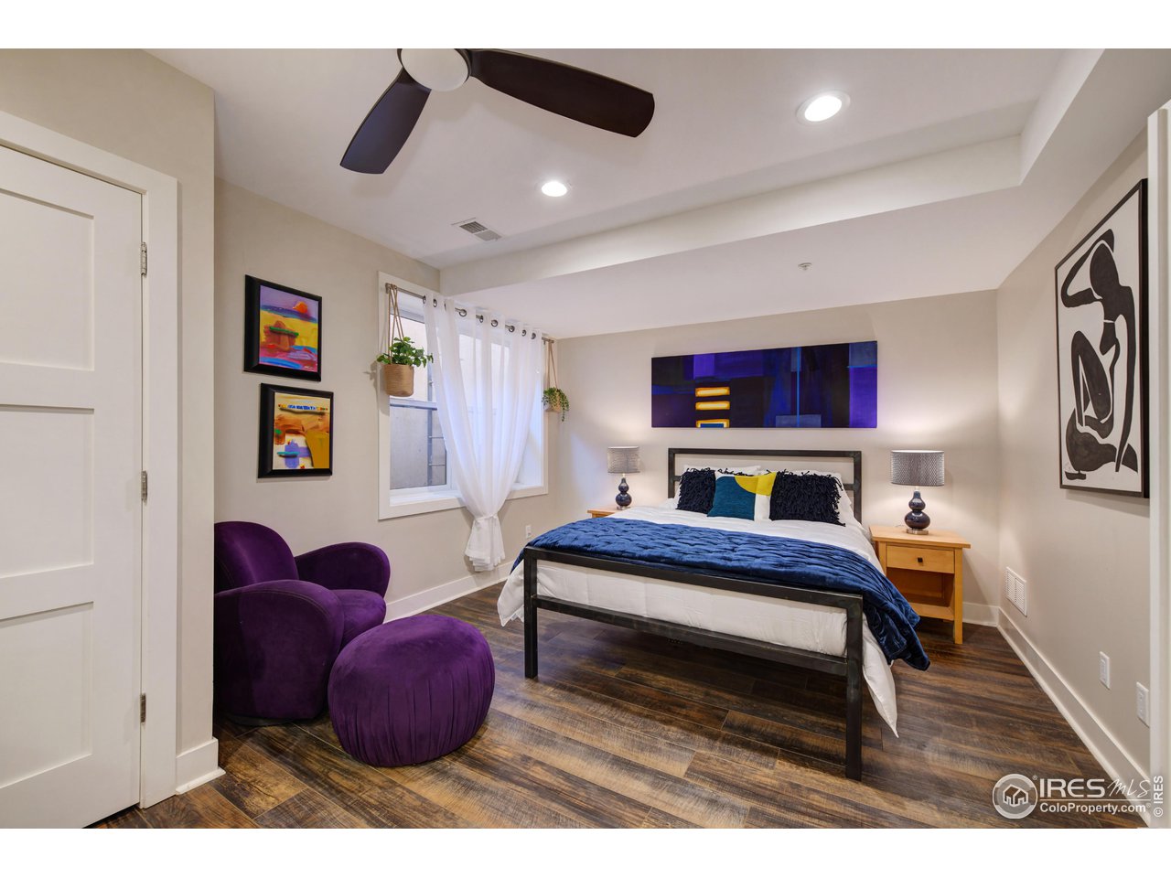 1217 High Street Boulder, CO 80304 - Photo 22 of 31 a bedroom with furniture and a book shelf