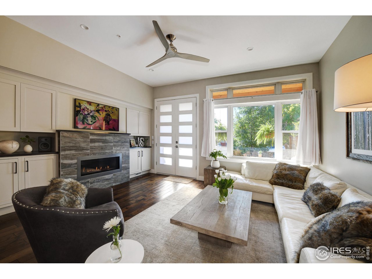 1217 High Street Boulder, CO 80304 - Photo 4 of 31 a living room with furniture large window and a fireplace