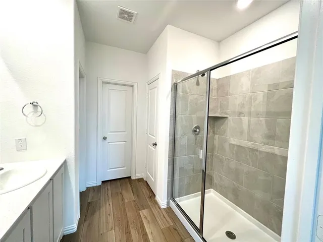a bathroom with a bathtub and a sink