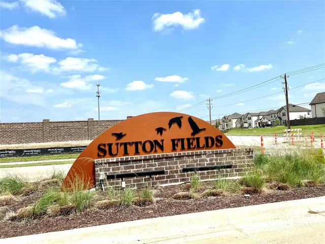a large swimming pool is in a backyard of a house