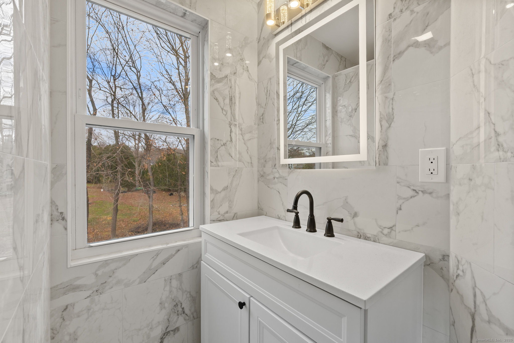 19 Henry Street Watertown, CT 06779 - Photo 26 of 37 a bathroom with a sink and a mirror