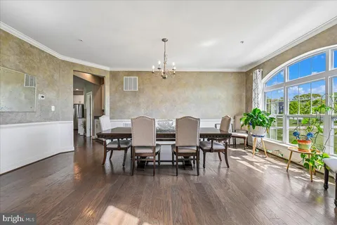 a view of hallway with wooden floor