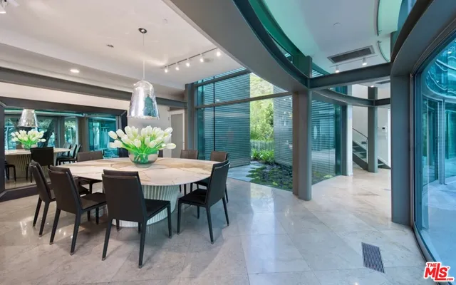 a view of a dining room with furniture and floor