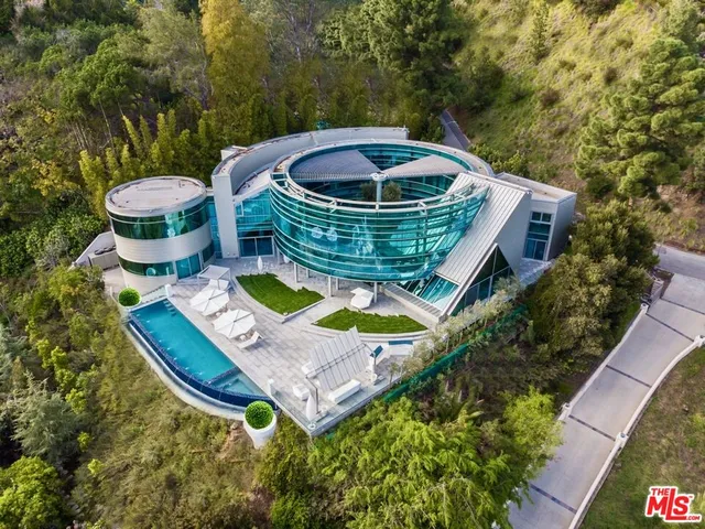a view of a swimming pool with a patio