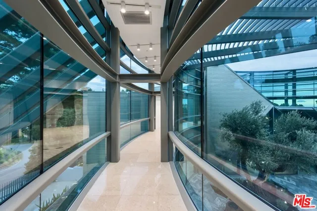 a bed room with a bed and a chair