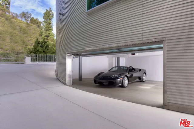 an aerial view of a house with outdoor space