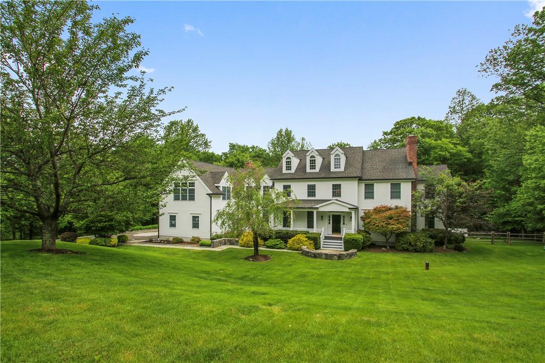 56 Dann Farm Road Pound Ridge, NY 10576 - Photo 1 of 1 a view of a house with a big yard