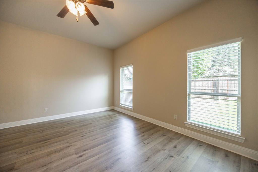 10500 Musketball Place McKinney, TX 75072 - Photo 19 of 40 a view of an empty room with wooden floor and a window