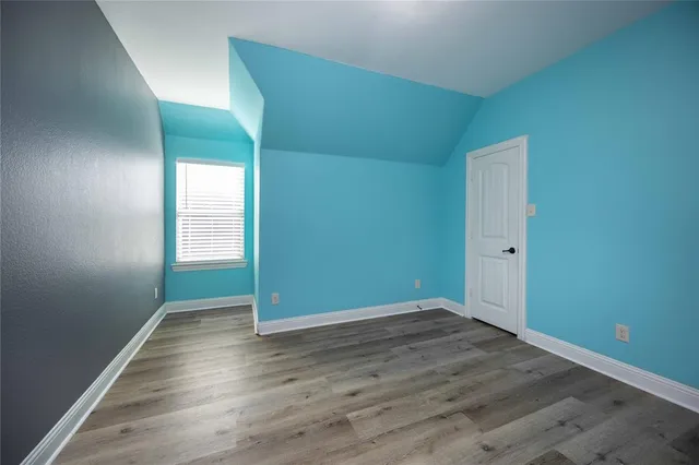 a view of a backyard with wooden fence