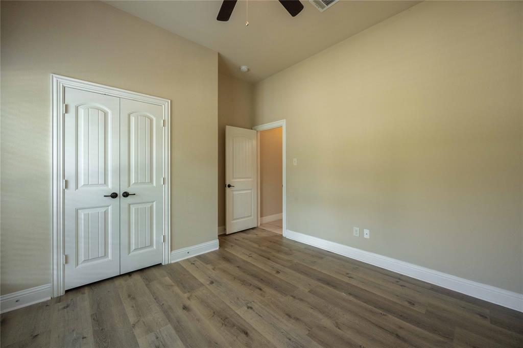 10500 Musketball Place McKinney, TX 75072 - Photo 4 of 40 a view of an empty room with closet and a window